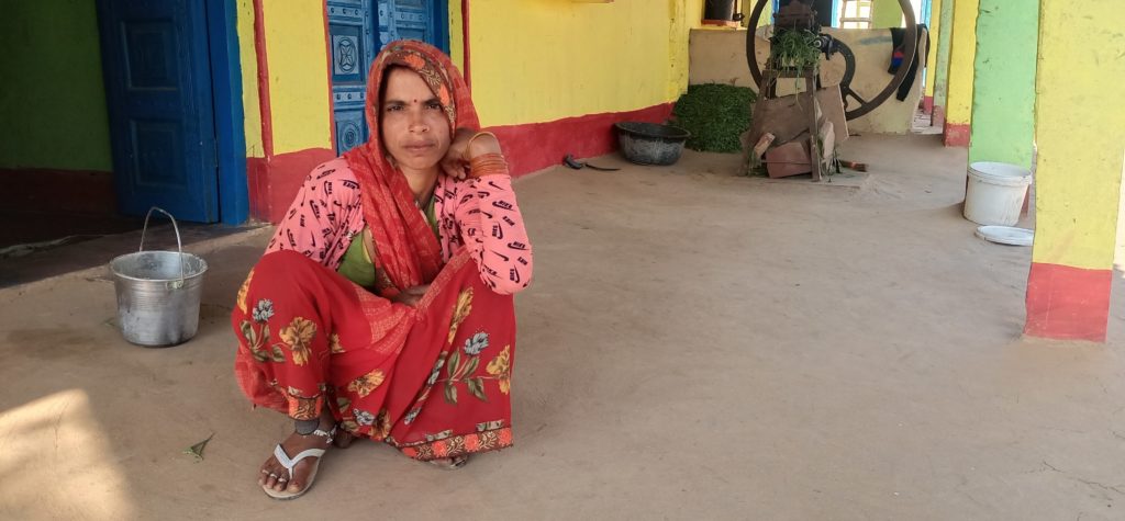 Sunita Devi, a daily wage worker, sitting at the porch of her home at a village in India’s Uttar Pradesh. Devi has been migrating for work to other states for 15 years but has stayed behind in the village.