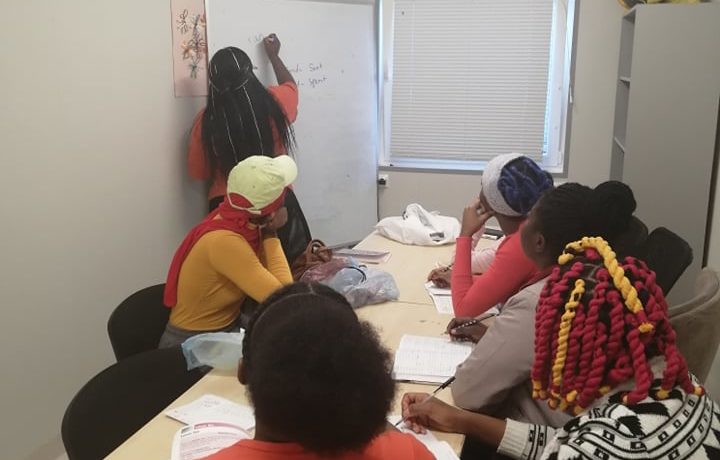 Carla teaching to a group of asylum seekers detained in Lithuania.