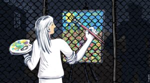 A woman paints a painting through a cage