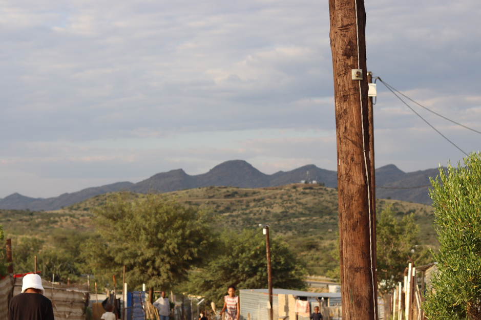 An electricity pole overlooks the township of Windhoek.